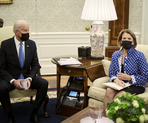 joe biden and shelley capito sit in oval office