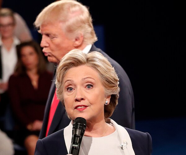 hillary clinton debates with president donald trump lurking behind her