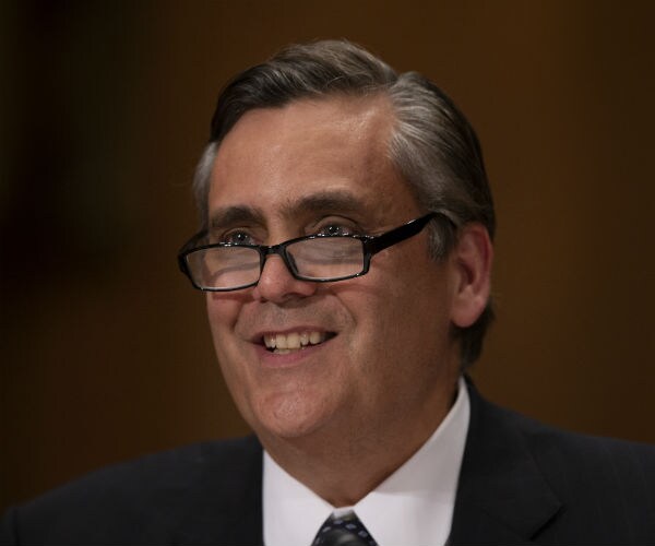 legal expert jonathan turley, wearing glasses, smiles wide