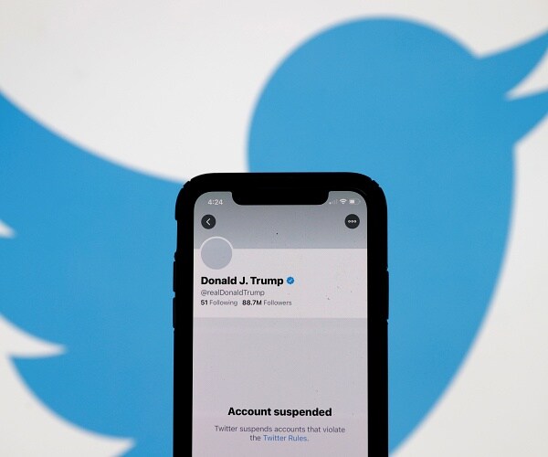 phone showing donald trumps suspended twitter account