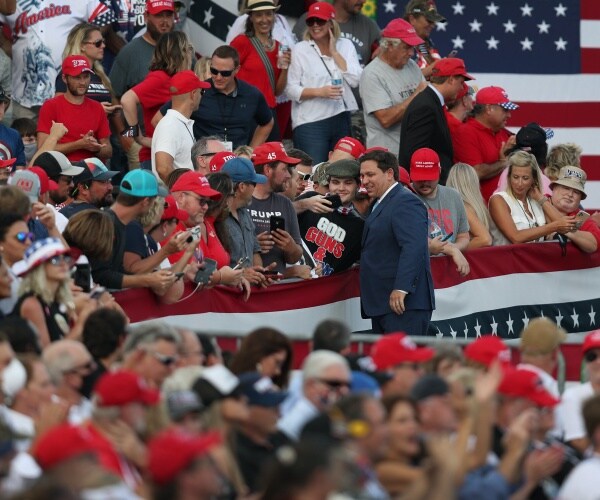  Ron DeSantis at a rally surrounded by people