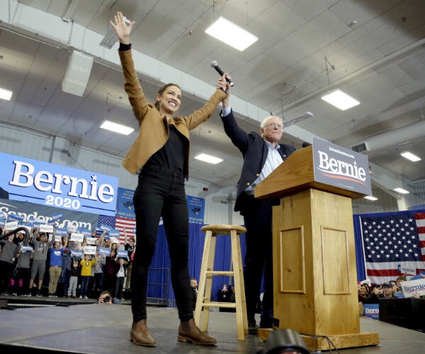 bernie sanders and alexandria ocasio-cortez on stage together in iowa