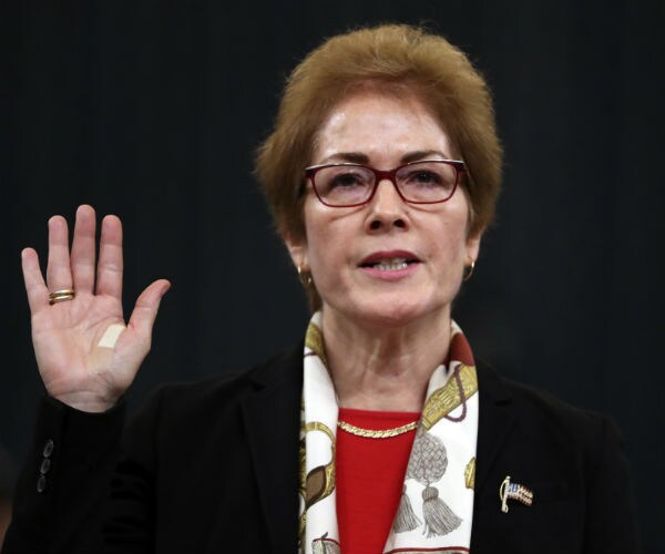 marie yovanovitch has her right hand up and she is sworn in to testify to the house intelligence committee