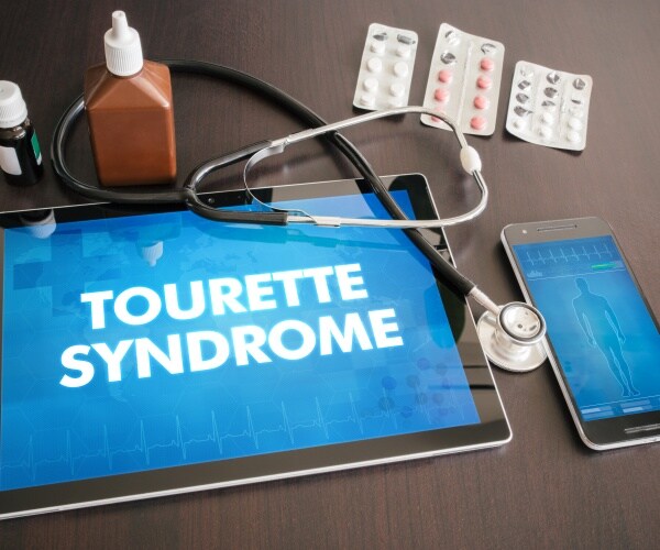 tablet with Tourette Syndrome on screen