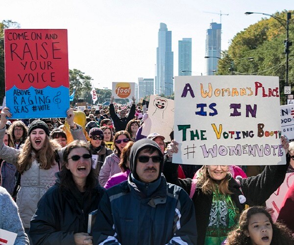 marchers holding signs