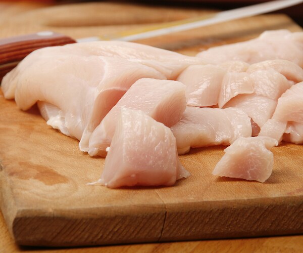 raw chicken on a cutting board