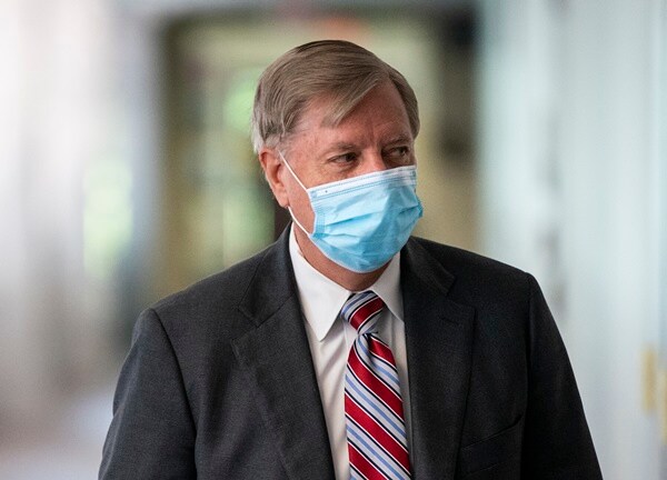 sen lindsey graham wears a mask in the halls of congress