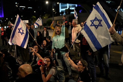 protesters hold israeli flags