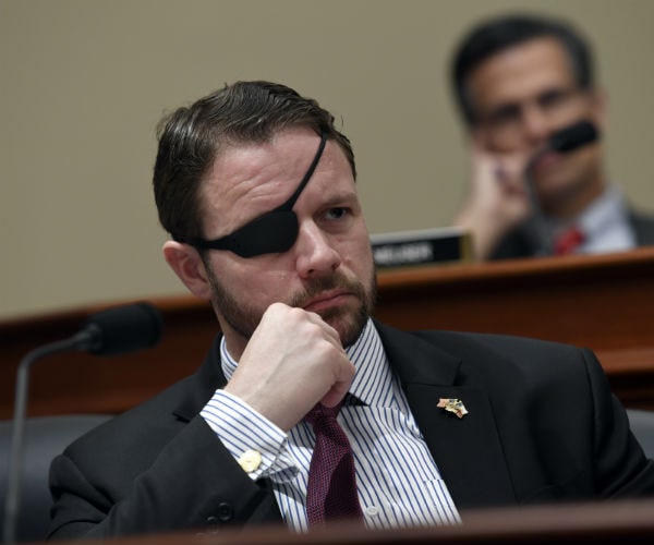 rep. dan crenshaw is showing wearing patch over his right eye