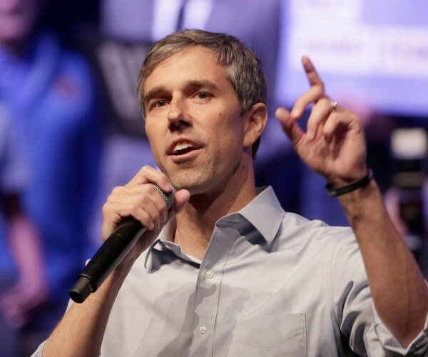 beto orourke talks into microphone