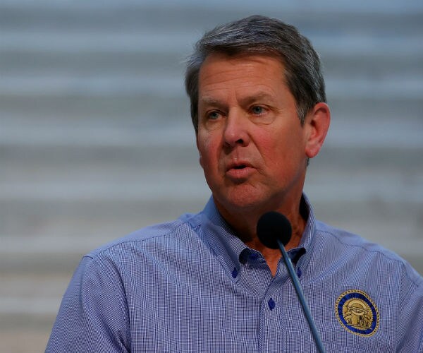 georgia governor brian kemp is seen speaking at a podium