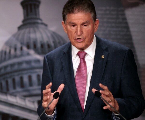 Joe Manchin talks to reporters at the U.S. Capitol 