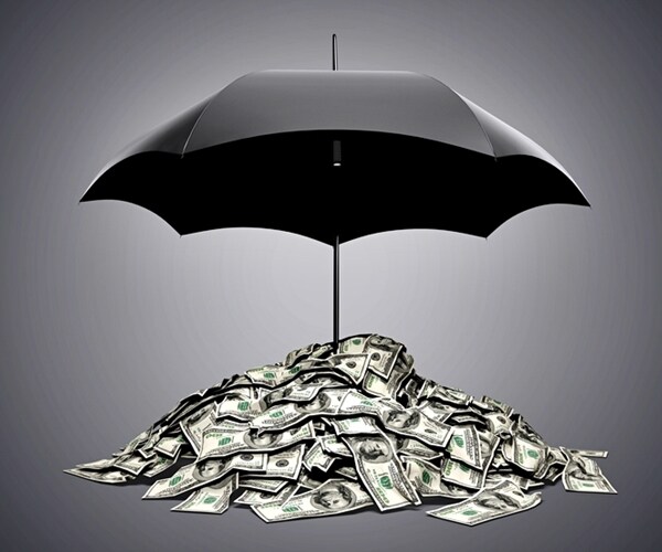 black umbrella above pile of $100 bills in currency protection 