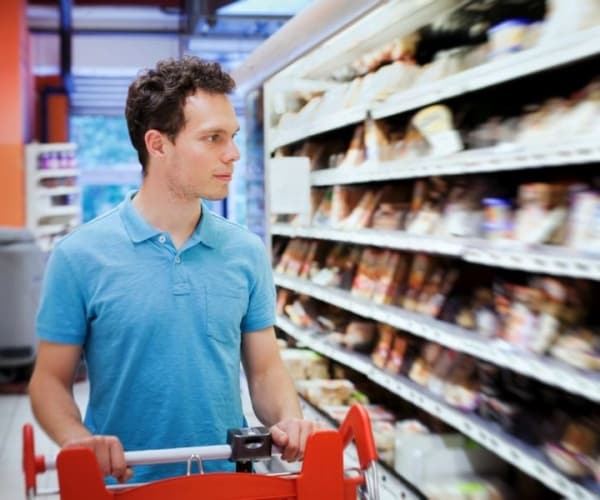 man shopping in supermarket