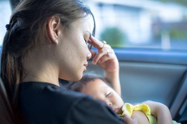 a stressed mother and a baby