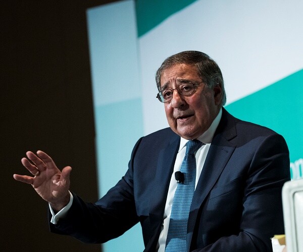 leon panetta sits onstage