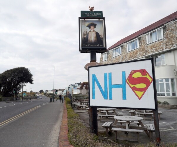 a sign shows support for the nhs in britain