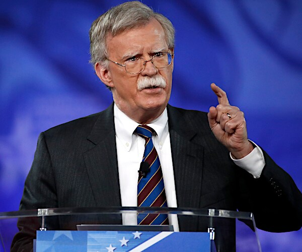 john bolton gestures during a news conference