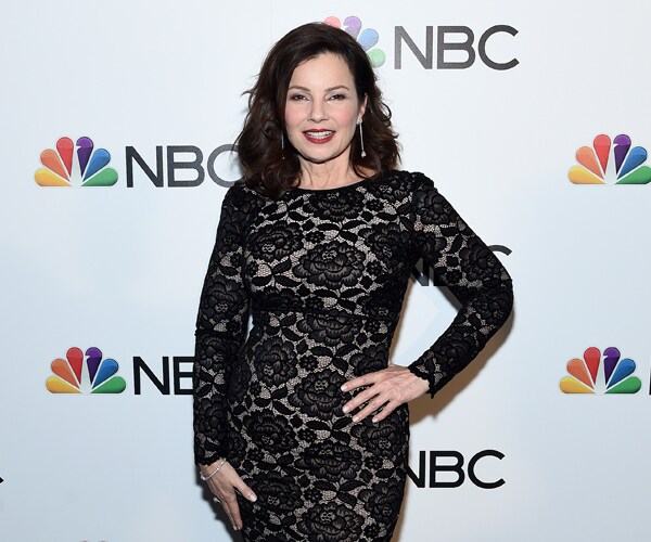 actress fran drescher posing for a photo while wearing a black dress