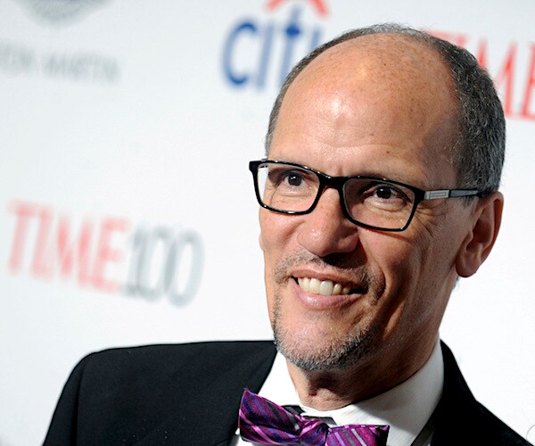 tom perez smiles on the red carpet