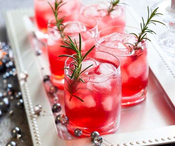 holiday cocktails on a tray with decorations