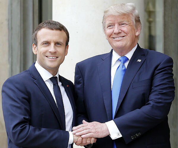 Too Close? Trump Brushes Dandruff Off Macron's Jacket