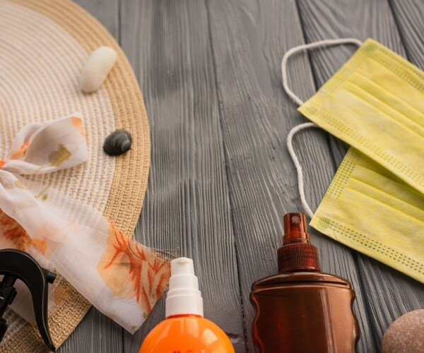 beach hat, suntan lotions, yellow masks