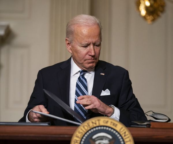 President Joe Biden signs a series of executive orders on climate change in the White House State Dining Room