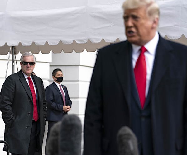 Mark Meadows listens as President Donald Trump speaks to the press outside the White House on October 30, 2020