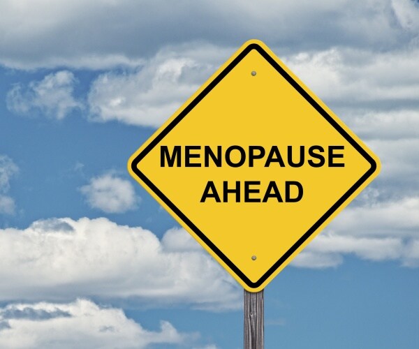 yellow caution road sign "menopause ahead"