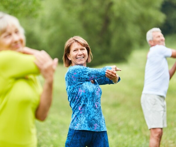 stretching class in a park