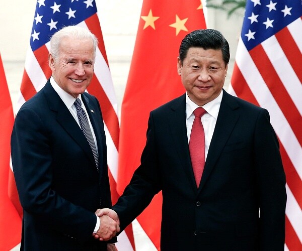 joe biden shakes hands with xi jinping