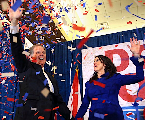 alabama democratic senator doug jones celebrates his special election victory with his wife in a sea of confetti