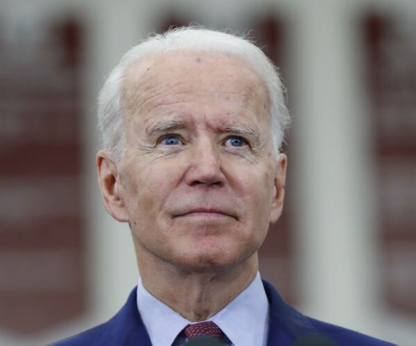 joe biden is seen at a campaign rally in detroit