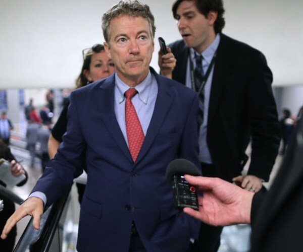 sen. rand paul speaks with the media in the halls of congress