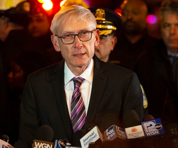 gov. tony evers speaks to the media after a shooting at molson coors brewing