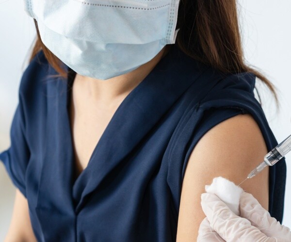 woman receiving a vaccine