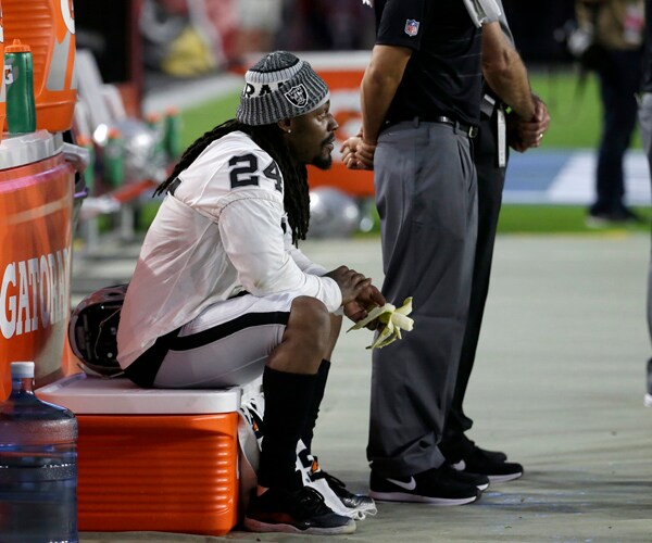 Marshawn Lynch Sits During National Anthem