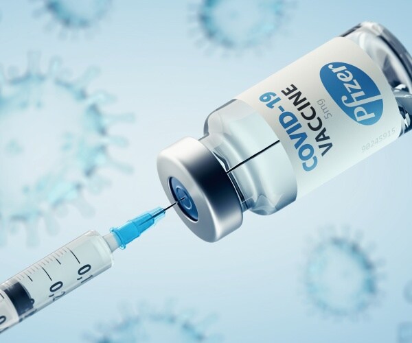 vial of Pfizer COVID vaccine, syringe