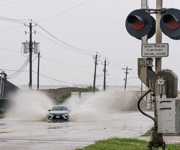 car drives through high water