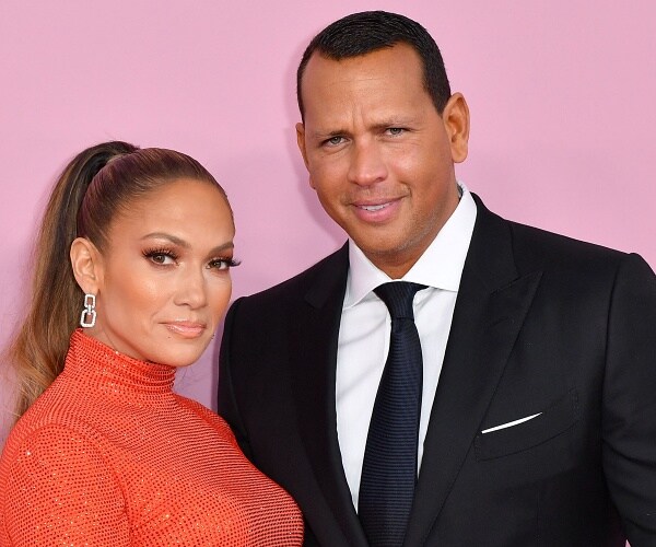 jennifer lopez and alex rodriguez stand on red carpet