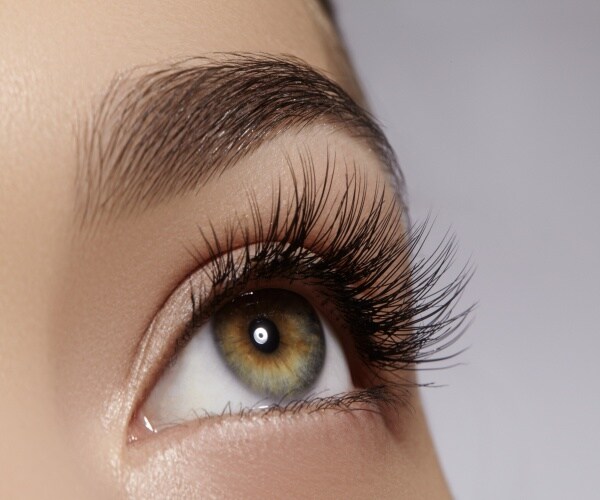 close up of a woman's eye with long eyelashes