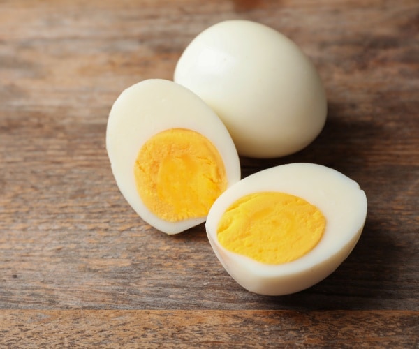 hard-boiled eggs on wood surface