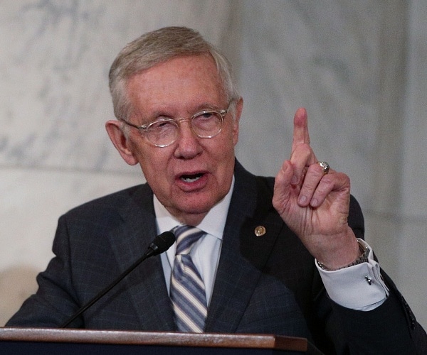 harry reid speaks into mic