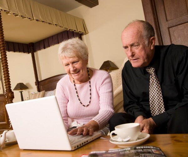 older couple looking at laptop