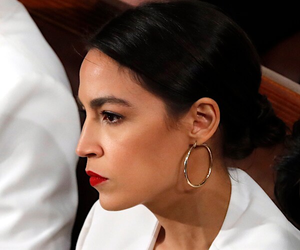 alexandria ocasio-cortez is stone-faced as she listens to president donald trump's state of the union address