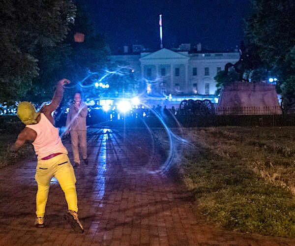 Protesters face off with police outside the White House in Washington, D.C., early Saturday morning