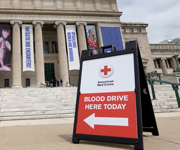 a sign for an american red cross blood drive in chicago