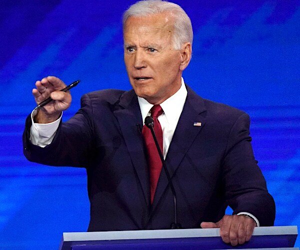 joe biden gestures with his right hand as he speaks during the democratic presidential primary debate