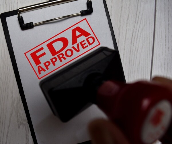 rubber stamp saying 'FDA approval'